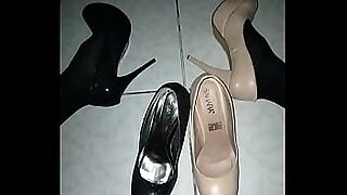 sexy girl giving heeljob in black heels