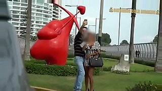 wife giving public blowjob while husband watches