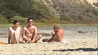 with two men on the beach